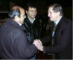 Senator and Congressman shake hands with Bro. Rysko after service.
