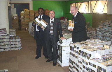 Pastor Joey shows Tony and Harley the depot and supply of literature for Africa