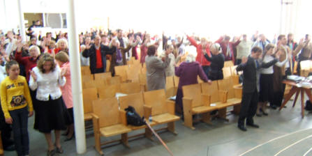 raised hands worshipping our Lord