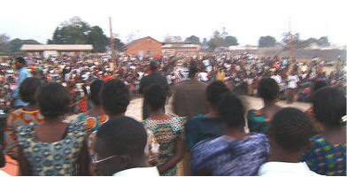 Thousands of Zambians attend the crusade and stand for hours.