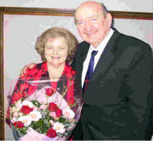 Tony and Marge Abram with flowers 